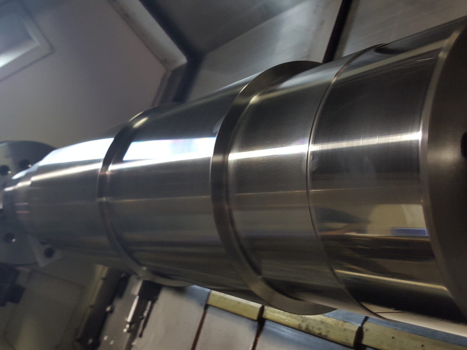 Large diameter roll being turned to a stepped profile