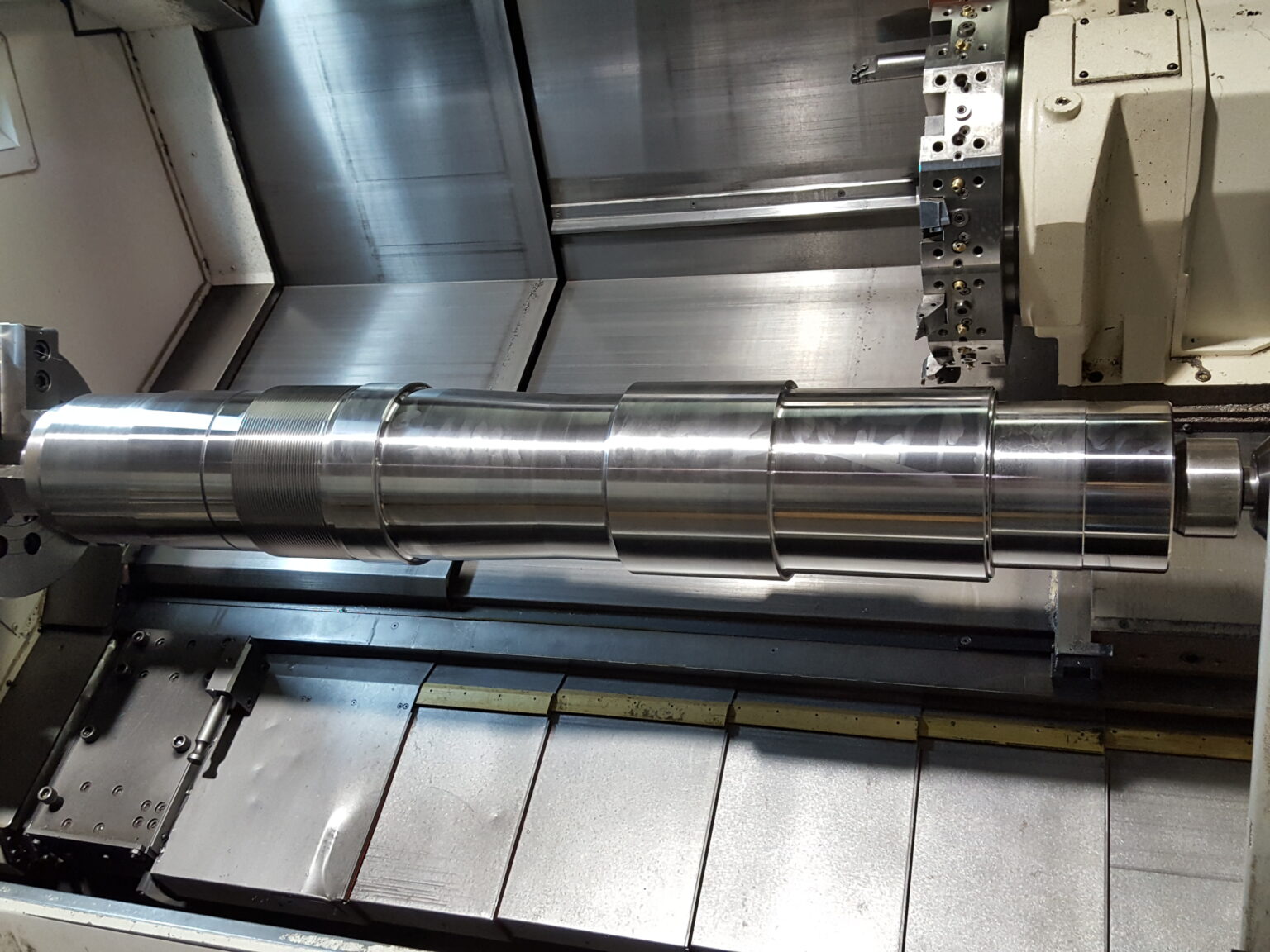 Precision stepped drive shaft manufactured at Zala Machine Co. featuring multiple diameters and keyed sections for high-torque industrial power transmission.