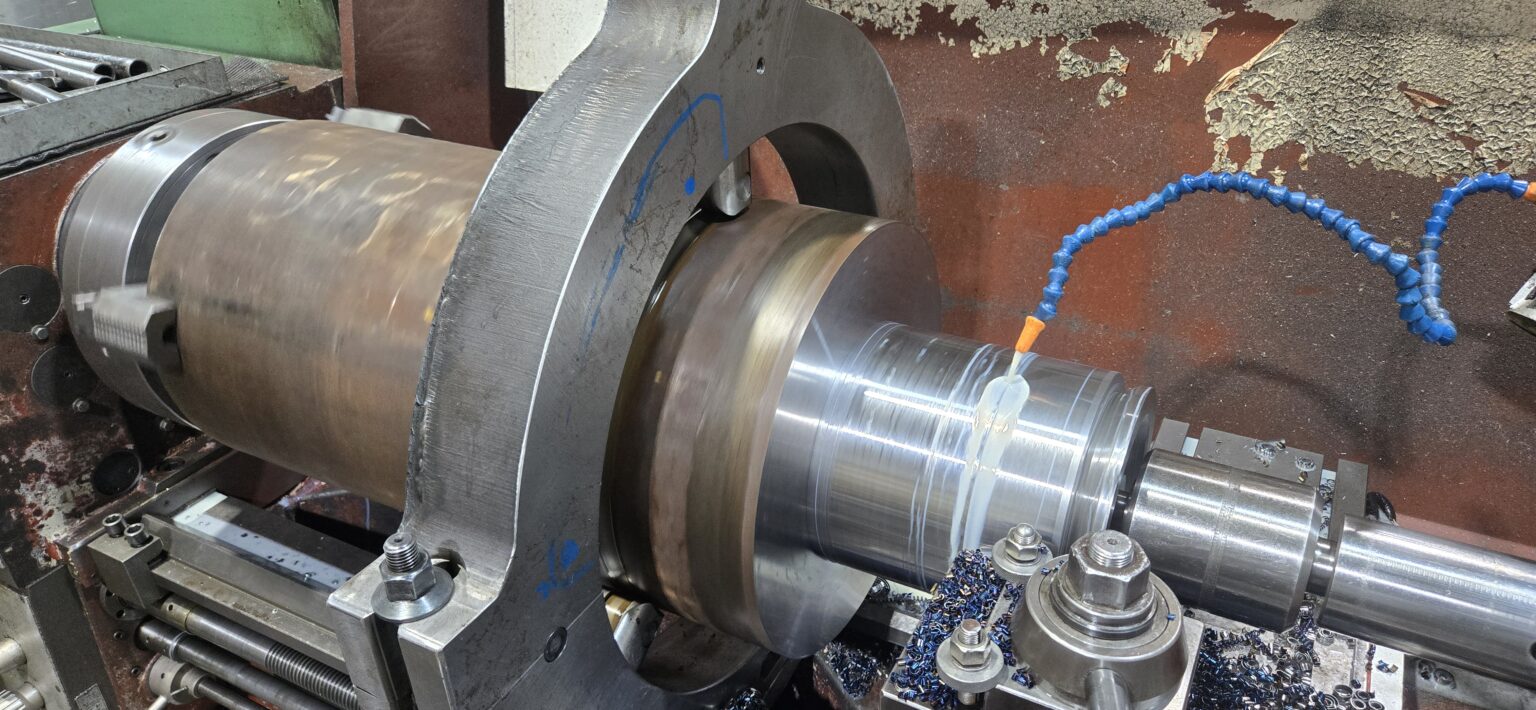 Large diameter bore being machined with coolant on a horizontal lathe