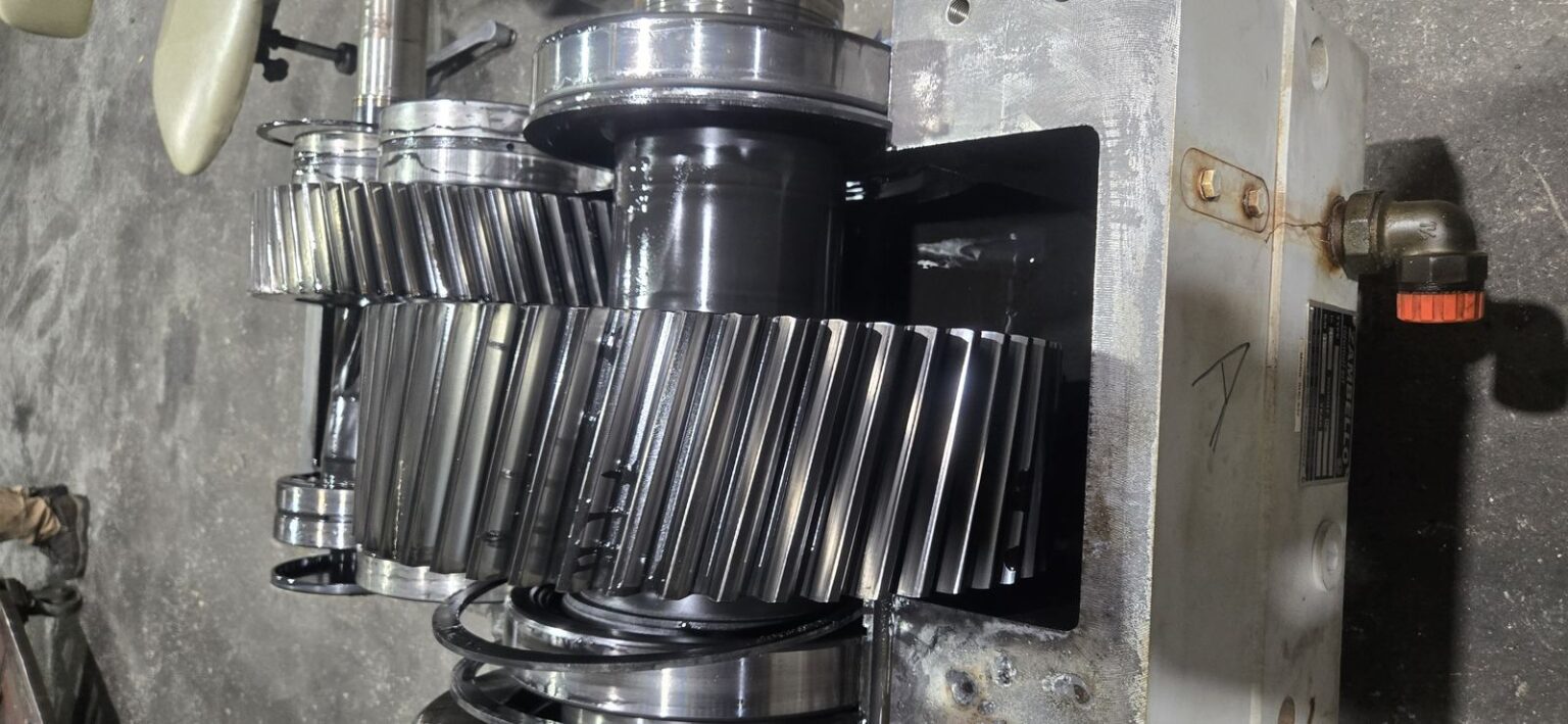 Helical gear stack removed from an extruder gearbox for measurement of tooth contact and journal diameters