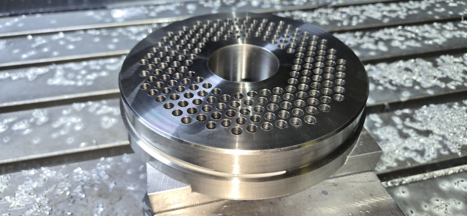 Breaker plate drilled on the CNC mill, even hole pattern around the center bore