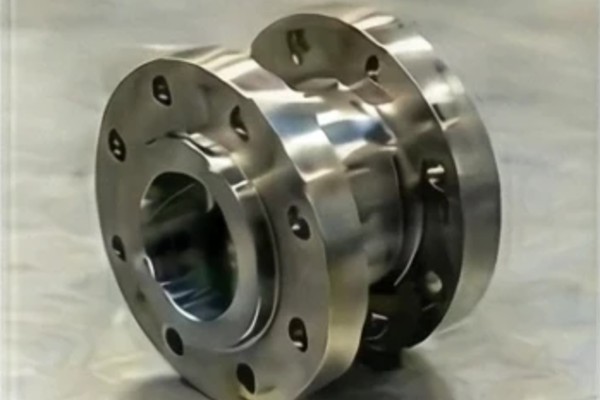 Illustration of a flanged gearbox-to-extruder adapter with bolt circles on both faces