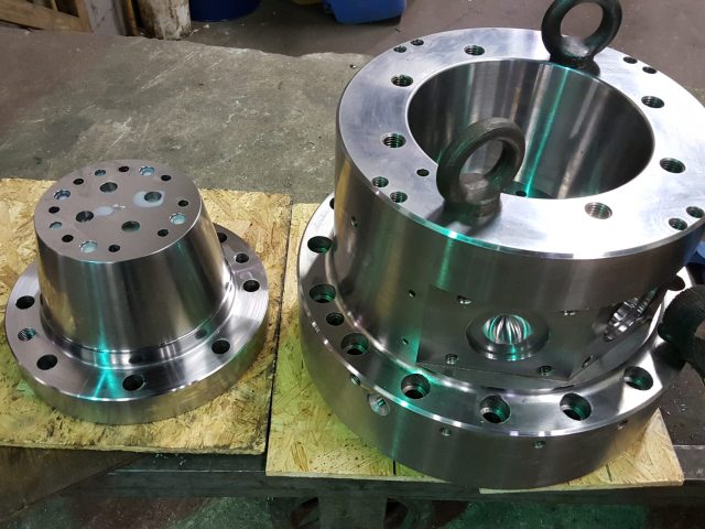 Die body with finished internal bore and mounting flange