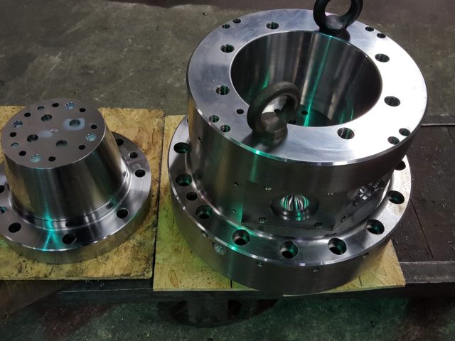Flanged die body resting on a pallet after machining