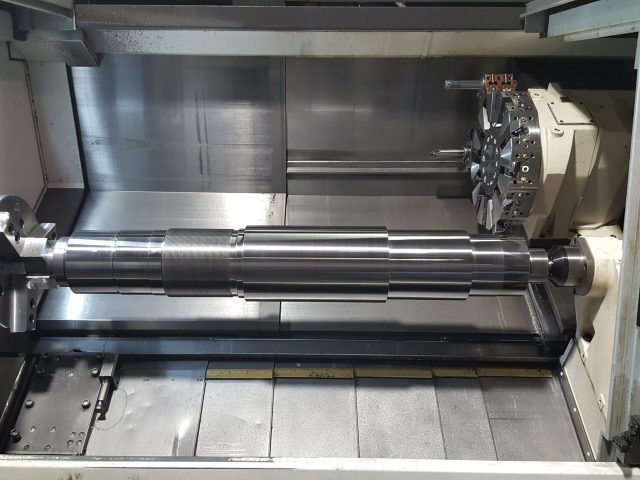 Long component set up on the CNC lathe bed