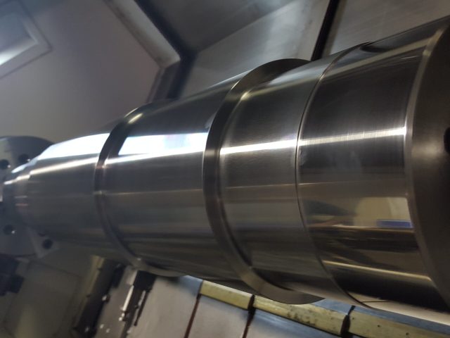 Large diameter roll being turned to a stepped profile