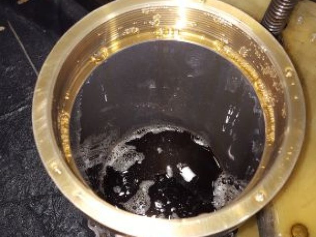 Cylinder bore being honed with coolant on the honing machine