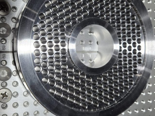 Breaker plate hole pattern checked on the inspection table