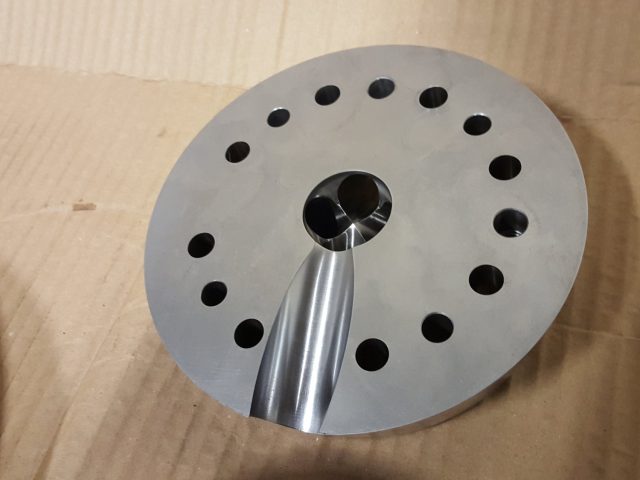 Teardrop melt port polished into the face of a blown film die distribution plate