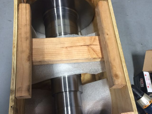 Finished part blocked and braced in its wooden crate, ready to ship