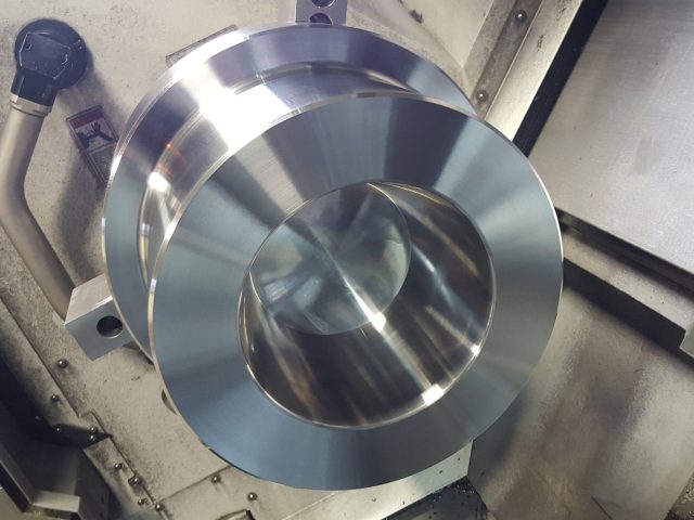 Second side of the die block finished on the lathe, tapered inner bore turned to size
