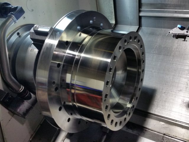 Large flanged housing in the CNC lathe, bolt circle drilled and the bore finish-turned