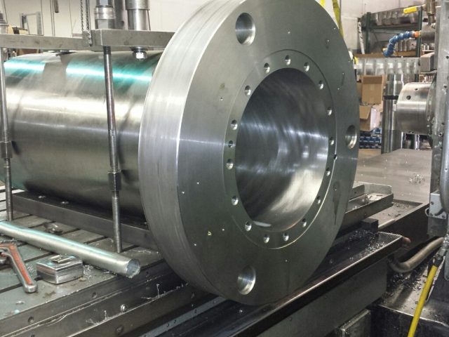Long housing on the boring mill, flange face and bolt circle finished around the bore
