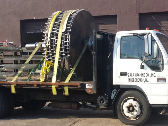 Large spur gear strapped to the Zala Machine flatbed for delivery, Hillsborough NJ lettering on the door