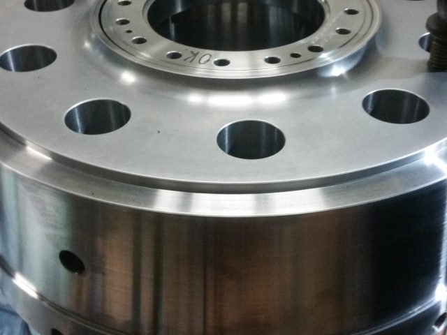 Top of the machined housing body, outer bolt flange and inner bolt circle around the bore
