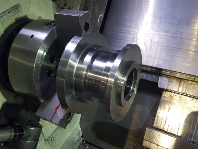 Stepped hub turned in the CNC lathe chuck, diameters and bore cut to size